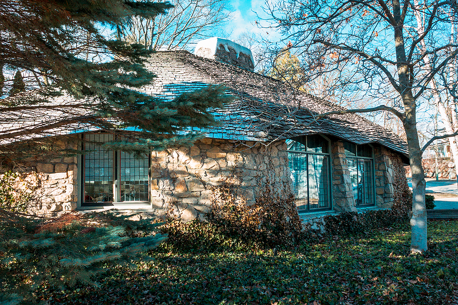 Charlevoix, MI /USA - March 2nd 2018: Looking at one of Earl Youngs Mushroom houses through the trees